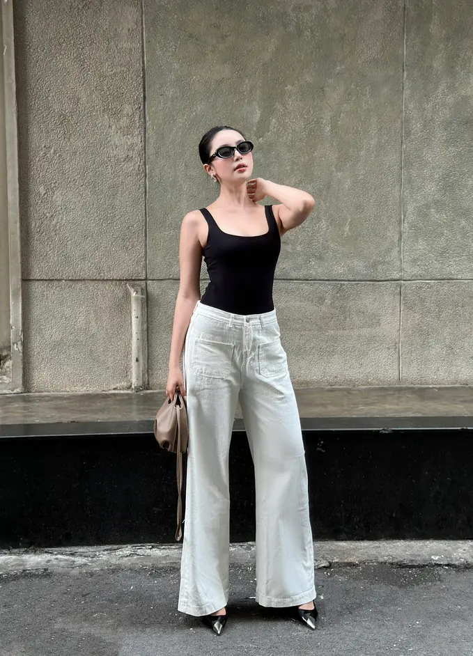 A vibrant spring look with wide-leg jeans highlighting dynamic fashion.